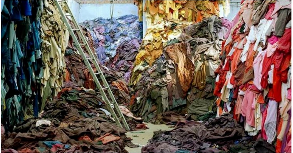 a landfill with mountains of clothes due to fast fashion from the University of Queensland.