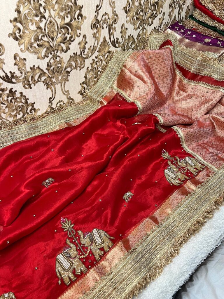 Gajraaj red Banarasi tissue silk saree with hand embroidery and traditional elephant motifs