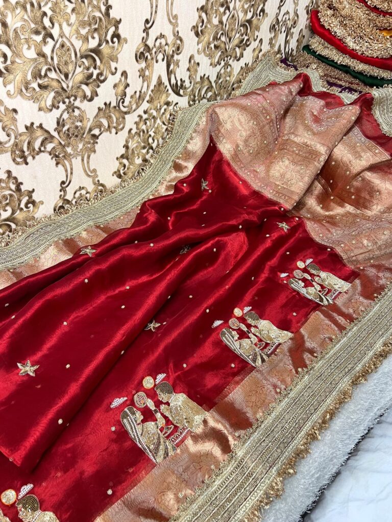 Royal red Banarasi tissue silk saree with Karwa Chauth motifs and golden zari border